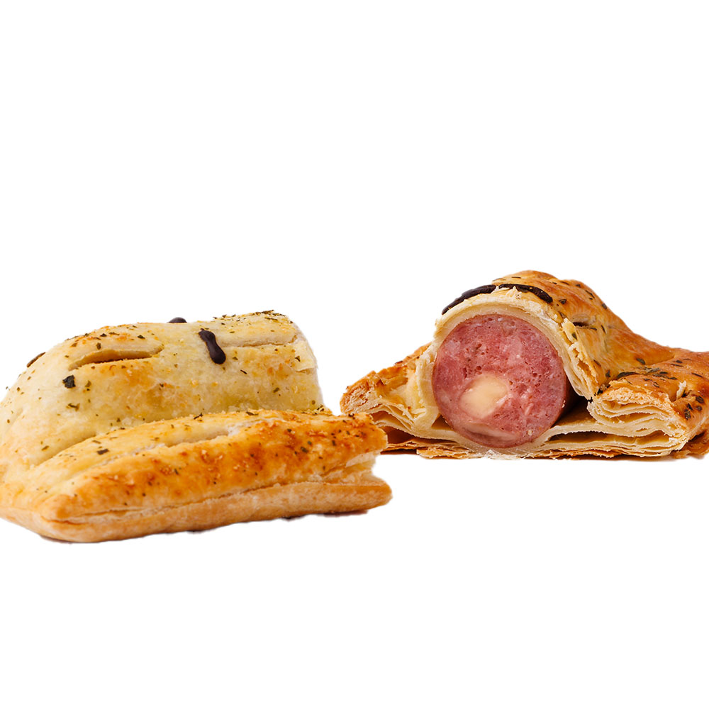 Pie Face Pork & Sage Kransky sausage roll, top view, featuring seasoned flaky pastry and a hand-drawn smiling face in dark icing